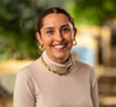 Woman smiling and facing camera