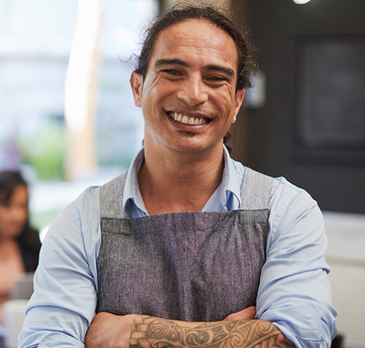 Man in apron smiling
