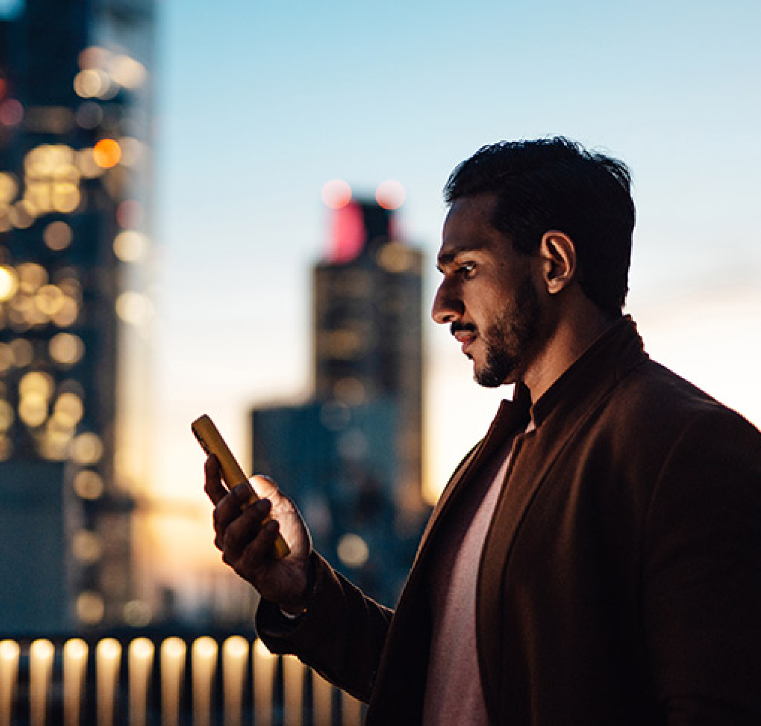 Man on phone outdoors in city