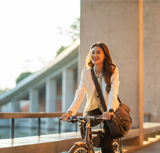 Smiling woman riding bike