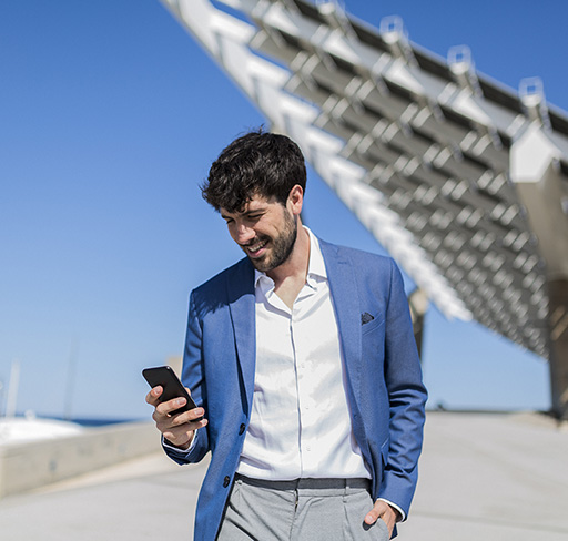 man smiling using phone