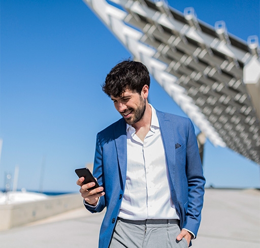 A person watching phone and smiling