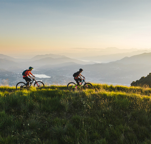 two-people-cycling-in-mountain