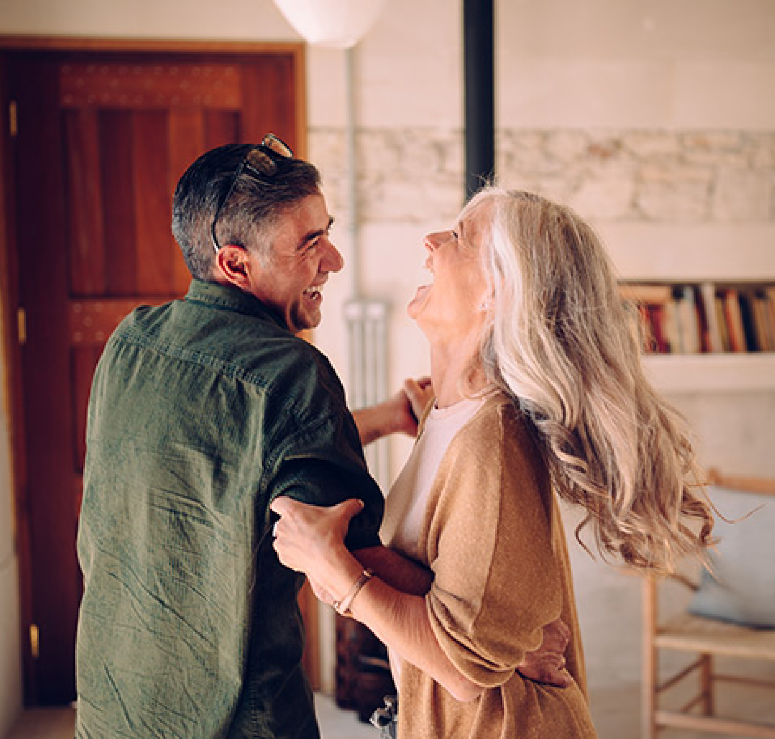 Couple dancing in living room