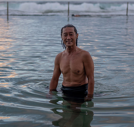 Man standing in ocean pool