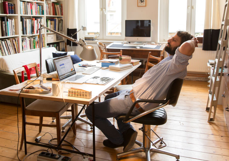 a man siting on a chair and thinking