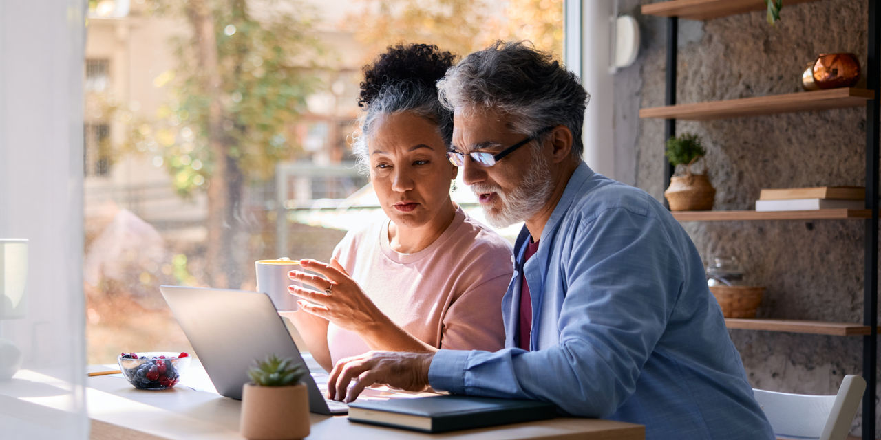 A couple looking at a laptop