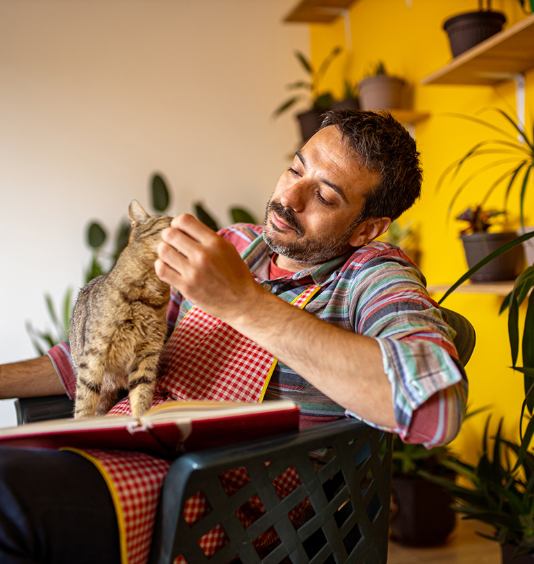 Man relaxing with cat