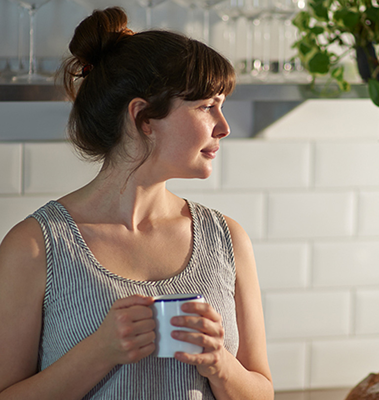 Lady holding coffee mug