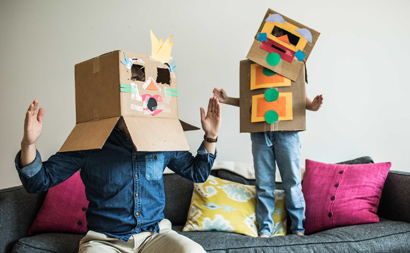 Dad playing with kid with mask