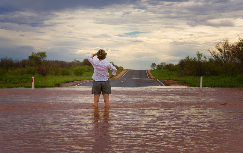 Woman on flooded road