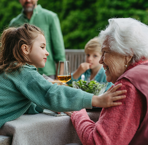 Young girl comforts grandmother
