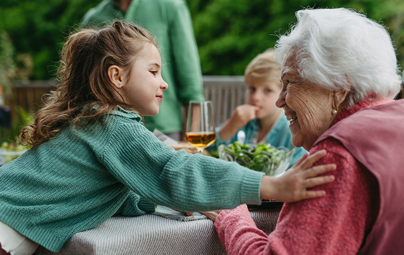 Young girl comforts grandmother