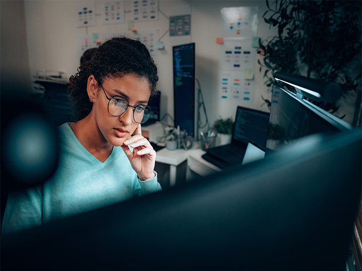 A women wearing glass and watching