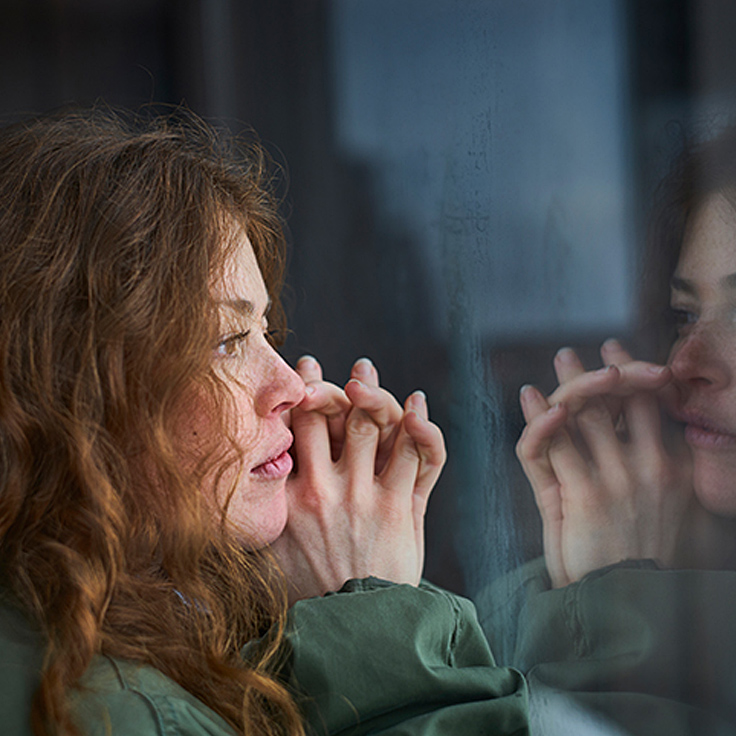 Woman gazing out window