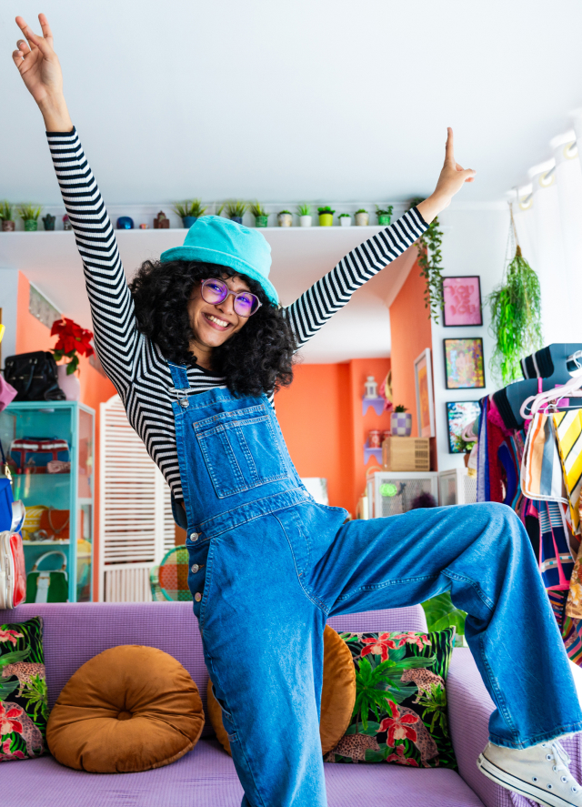 Girl wearing jumpsuit and dancing