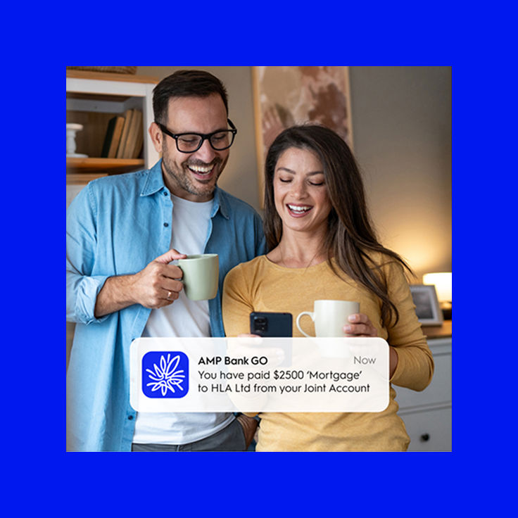 Couple having coffee smiling at phone