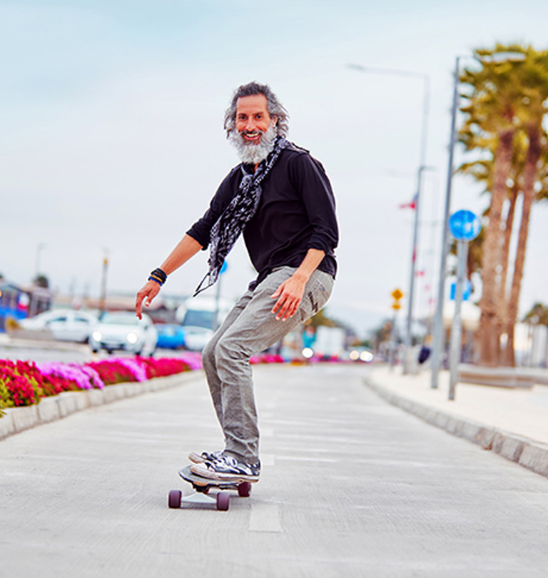 grey-bearded-man-skateboarding