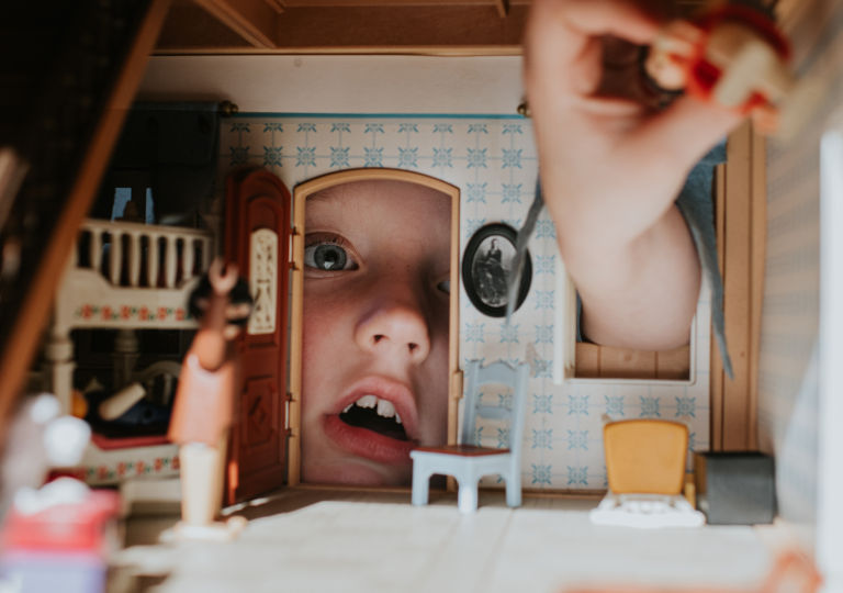 Home loans child playing dollhouse