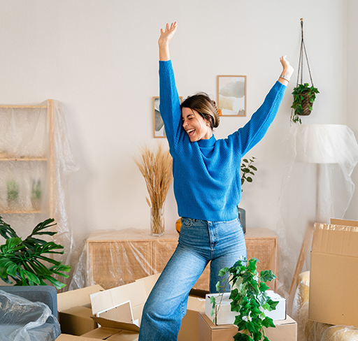 A woman dancing wearing blue sweater