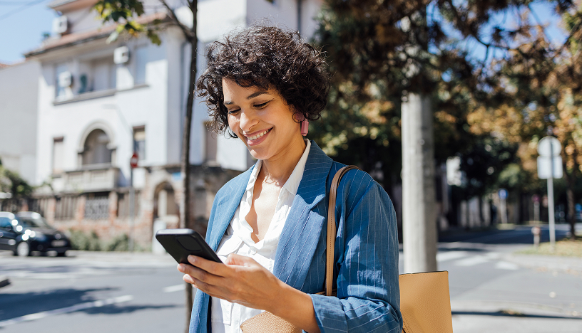 Woman smiling down at phone