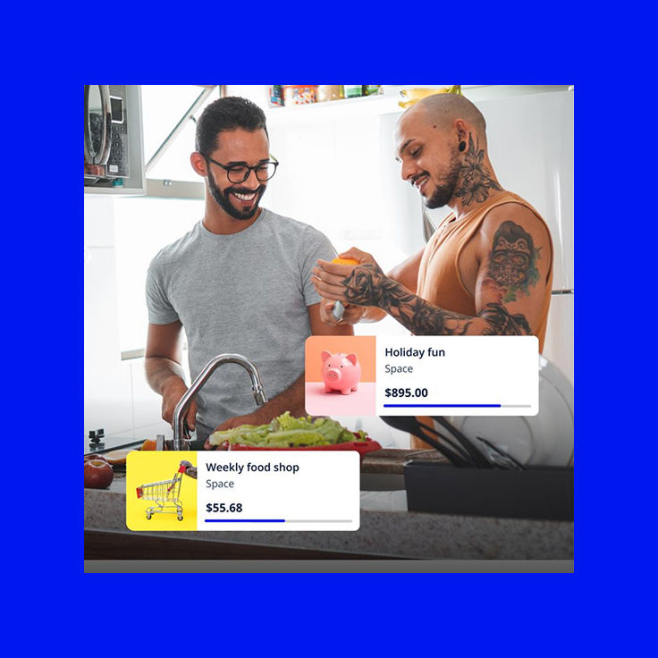 Two men cooking together in kitchen