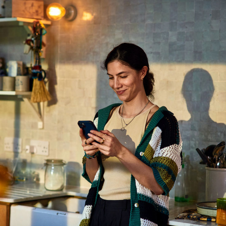Woman kitchen phone