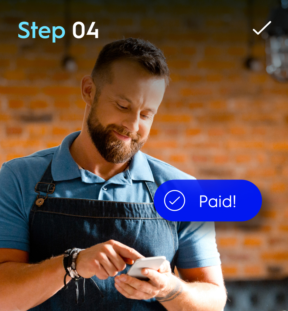 Man wearing apron tapping phone