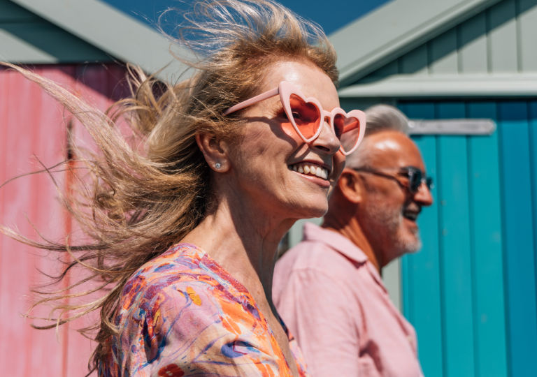 A man and woman smiling on a vacation