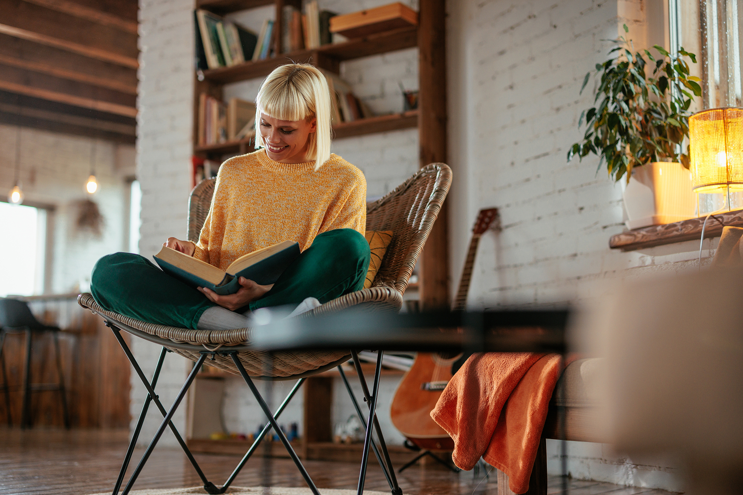 Woman cross legged chair reading