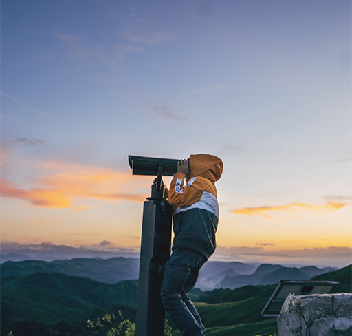 A person watching in telescope