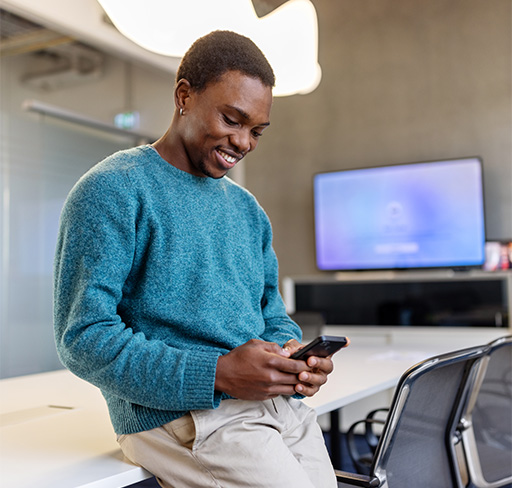 man smiling watching phone