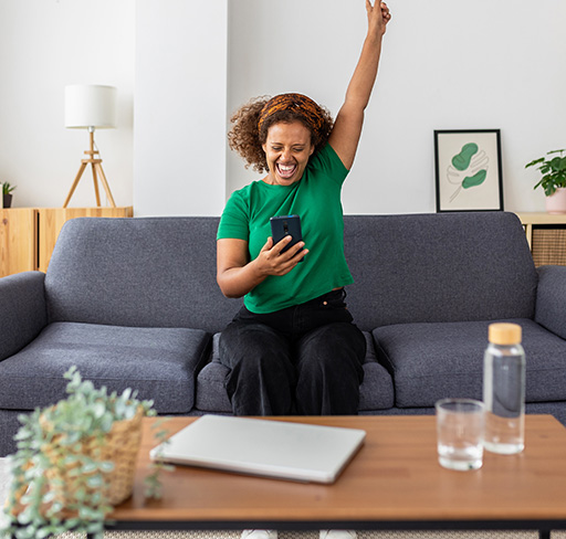 women feeling happy watching mobile