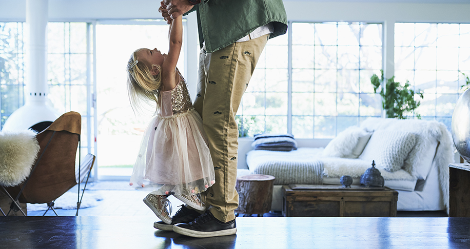 father and daughter in living room 