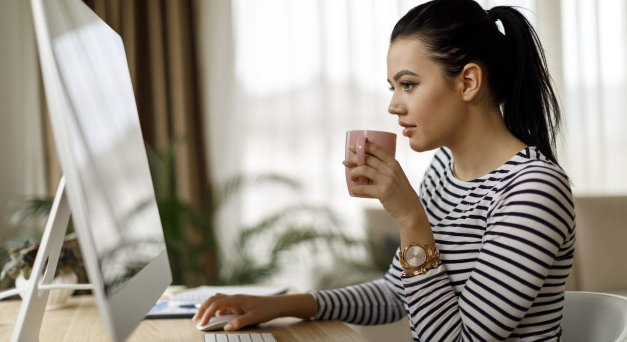 Woman sipping from a mug