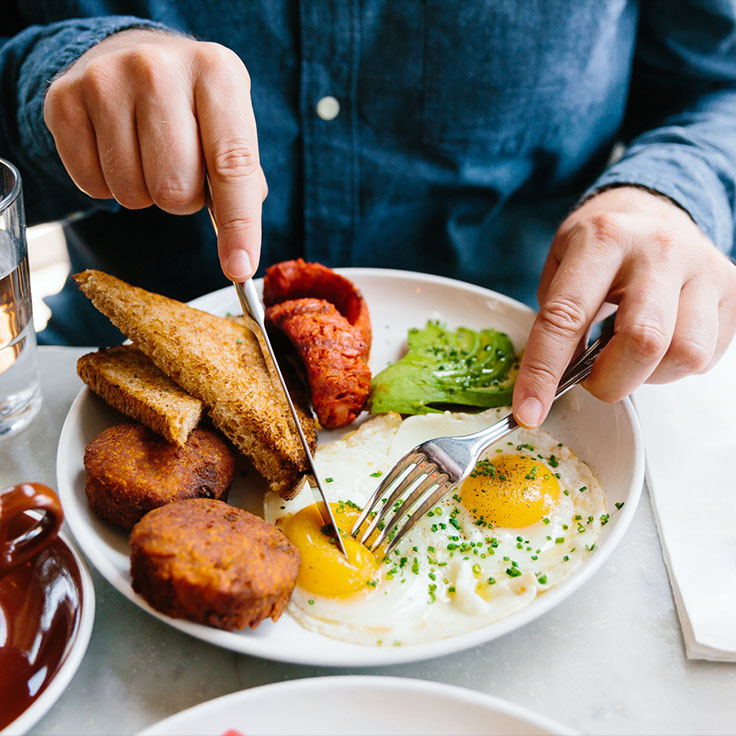 Person eating breakfast