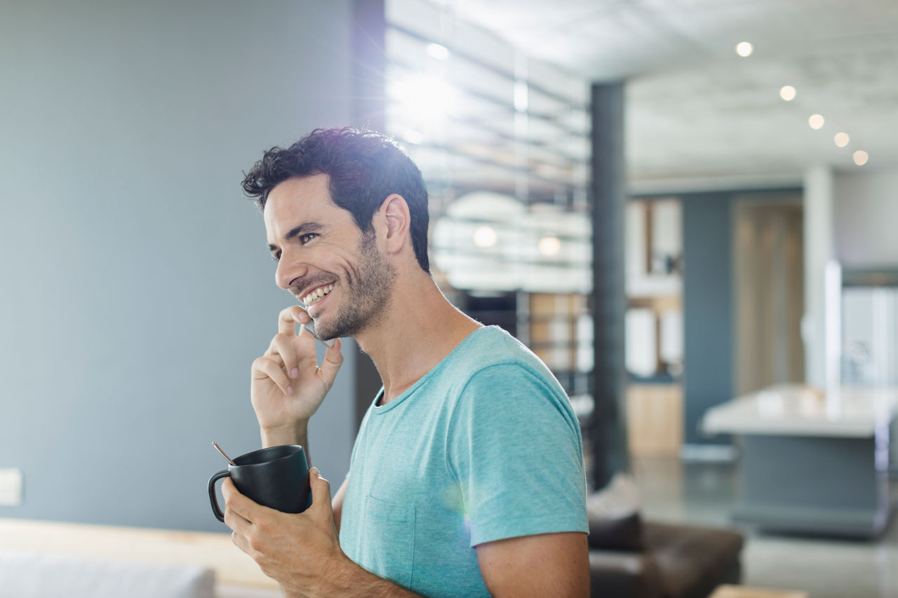 Man Calling with Coffee Mug